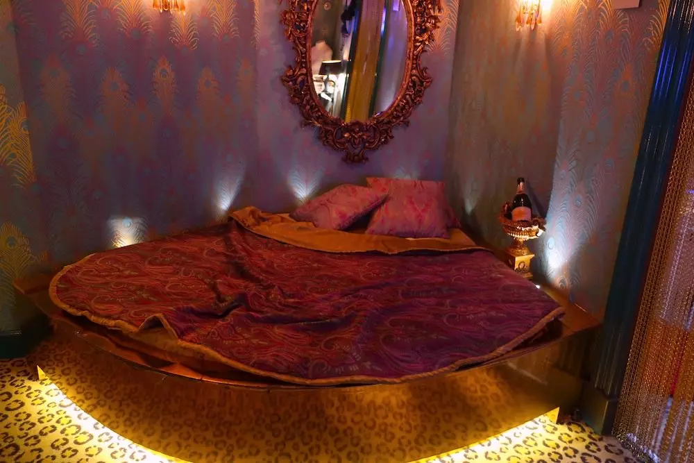a luxurious themed bedroom exhibit inside Red Light Secrets Museum of Prostitution in Amsterdam