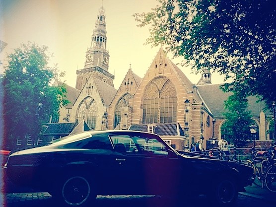 An awesome car standing in front of The Old Church in Amsterdam's Red Light District.