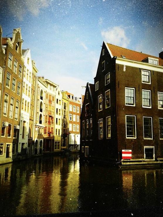 Oudezijds kolk and its buildings in Amsterdam's Red Light District.