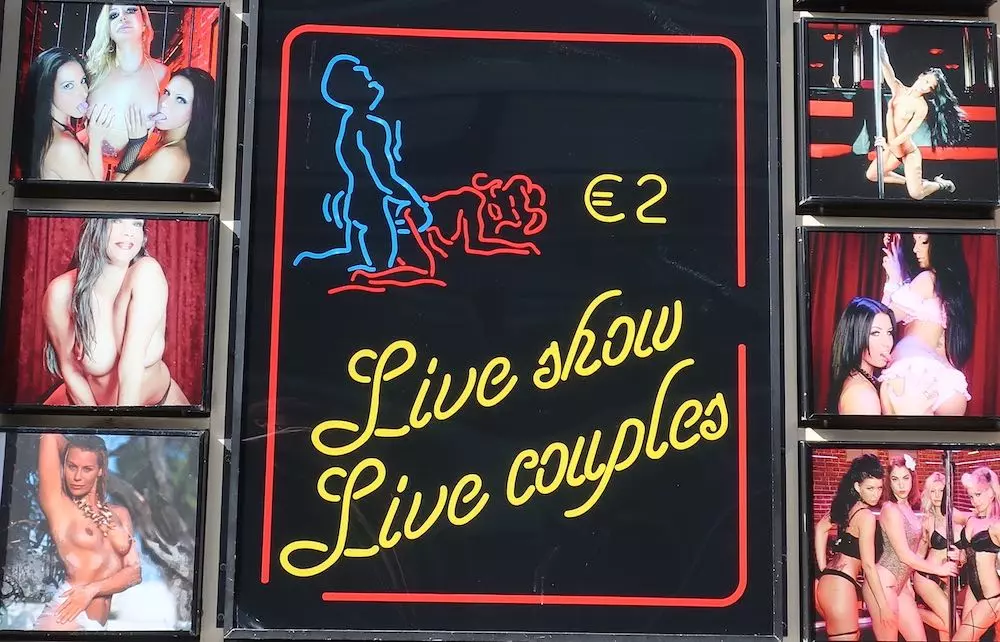Live show Live couples 2 euro peep show board in Amsterdam's Red Light District