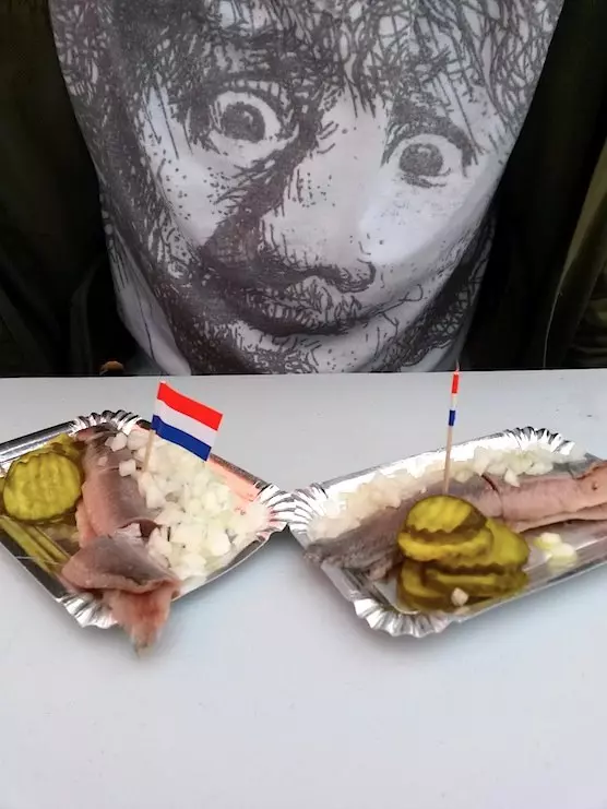 Dutch painter, Rembrandt van Rijn, had a delicious Dutch treat. He eat herring on the Albert Cuyp market.