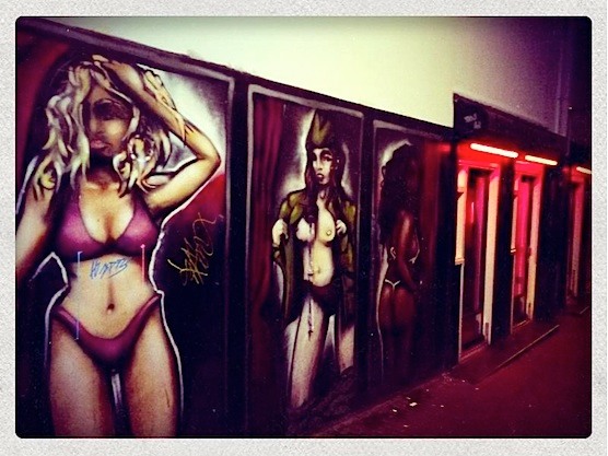 Street Art in Amsterdam Red Light District. Art work in a narrow alley next to the brothels.