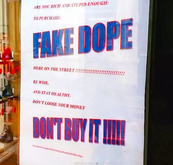 fake drug dealers in Amsterdam. Sign from local