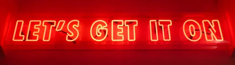 neon-lighting showing "let's get it on" mounted on the wall at Sex club LV in Amsterdam