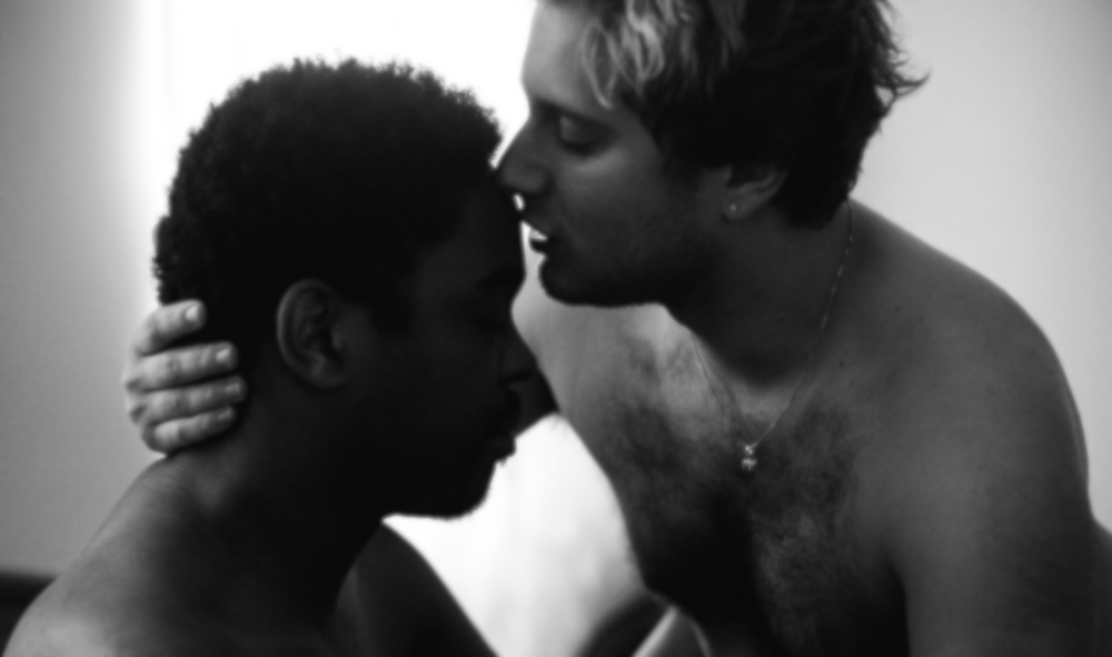 Two gay men making out