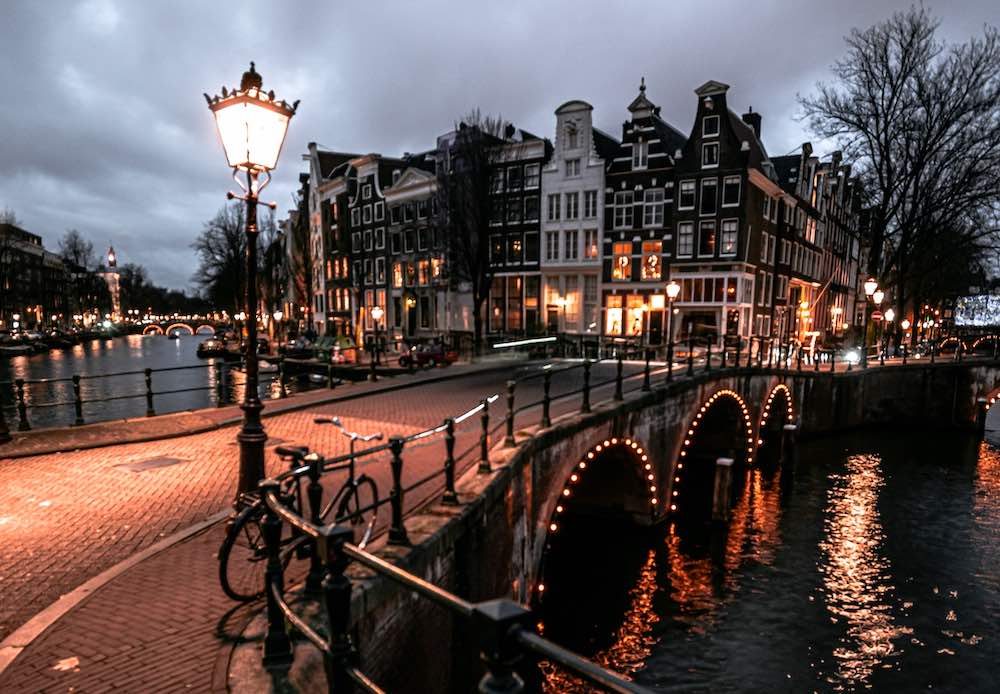 Amsterdam street by night showing houses on the background