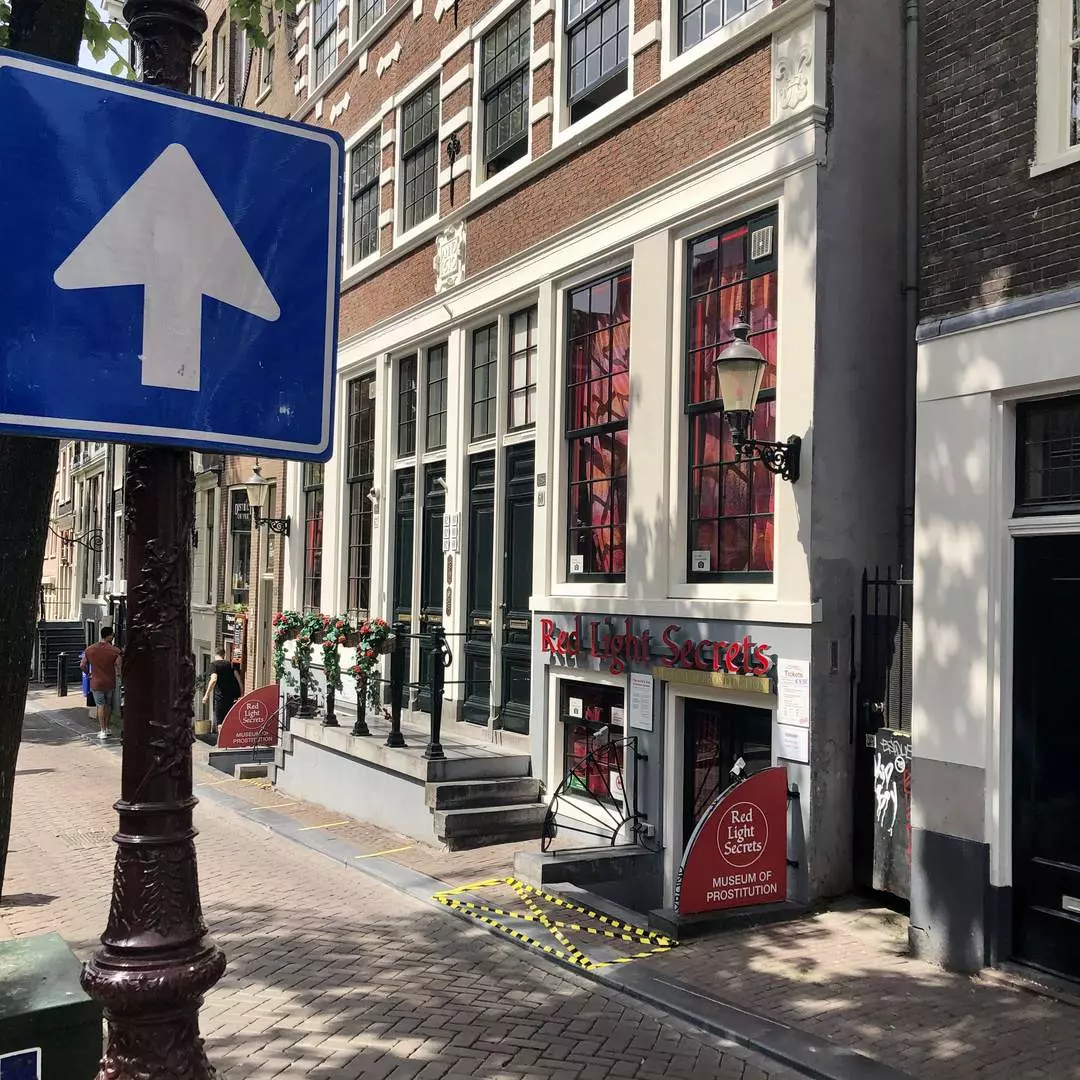 The Red Light Secrets Museum of Prostitution facade on Oudezijds Achterburgwal in Amsterdam's Red Light District
