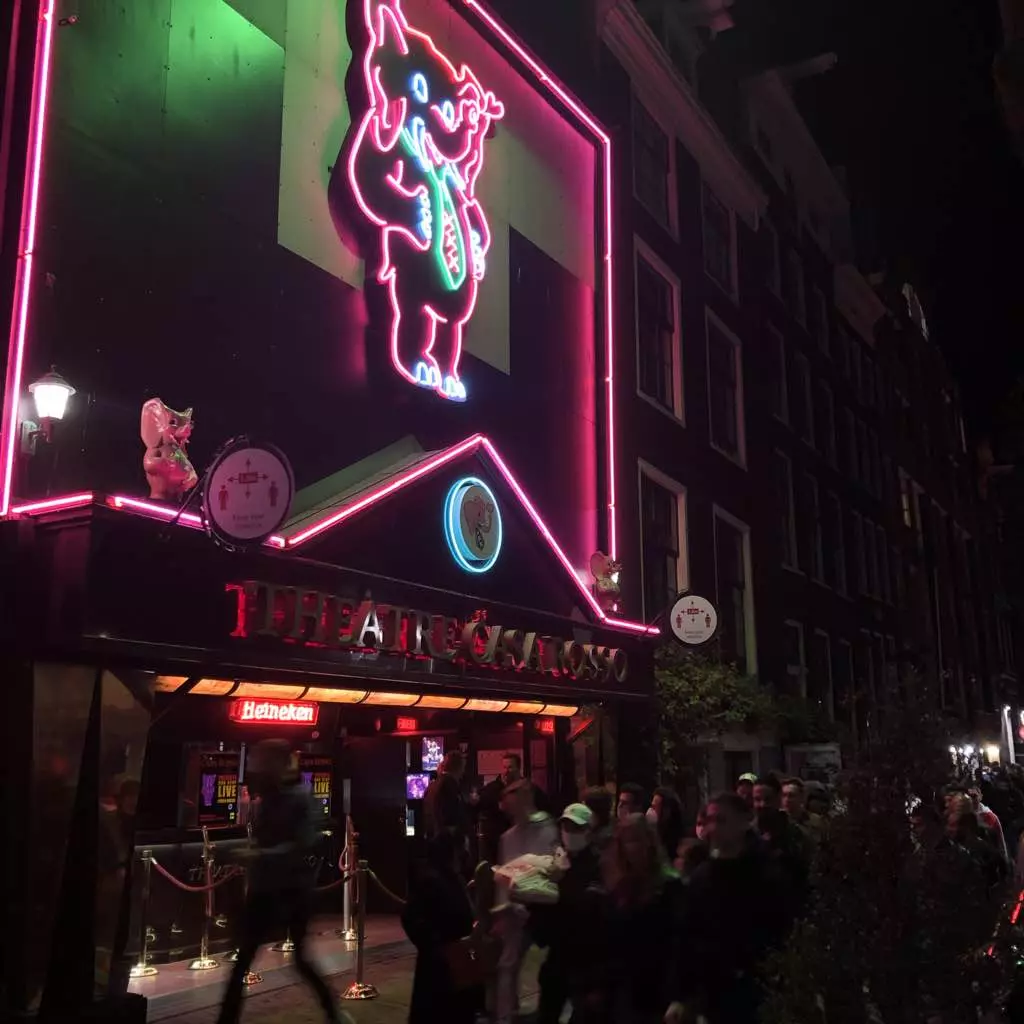 Casa Rosso entrance lit up at night in De Wallen