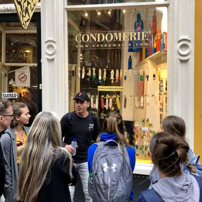 A Red Light District tour group on Warmoesstraat in Amsterdam, the route into De Wallen