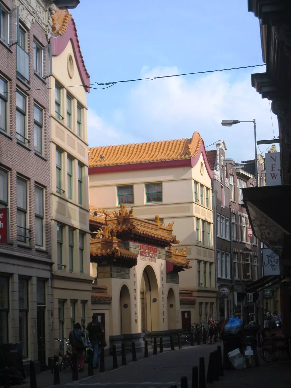 He Hua Temple seen down the Zeedijk between Dutch canal houses, Amsterdam Chinatown